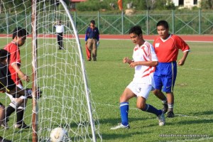 boys playing football